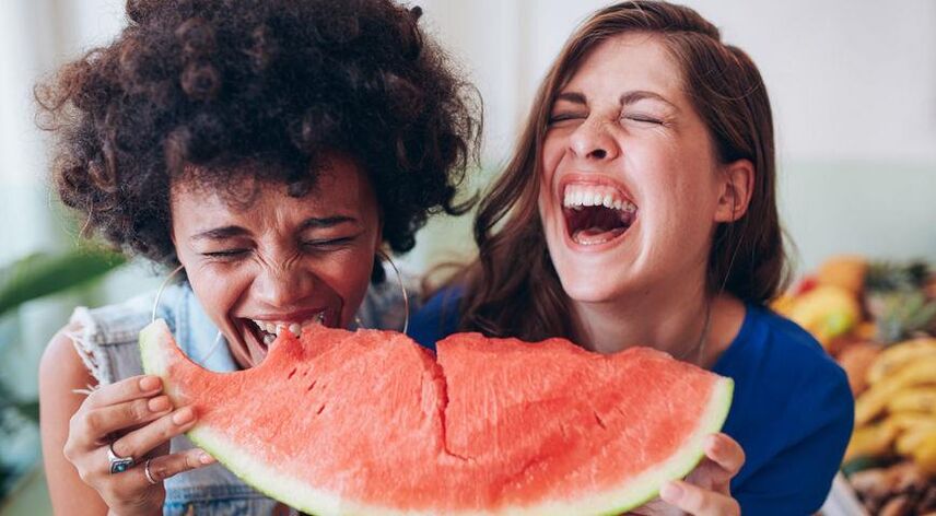 Girls eat watermelon